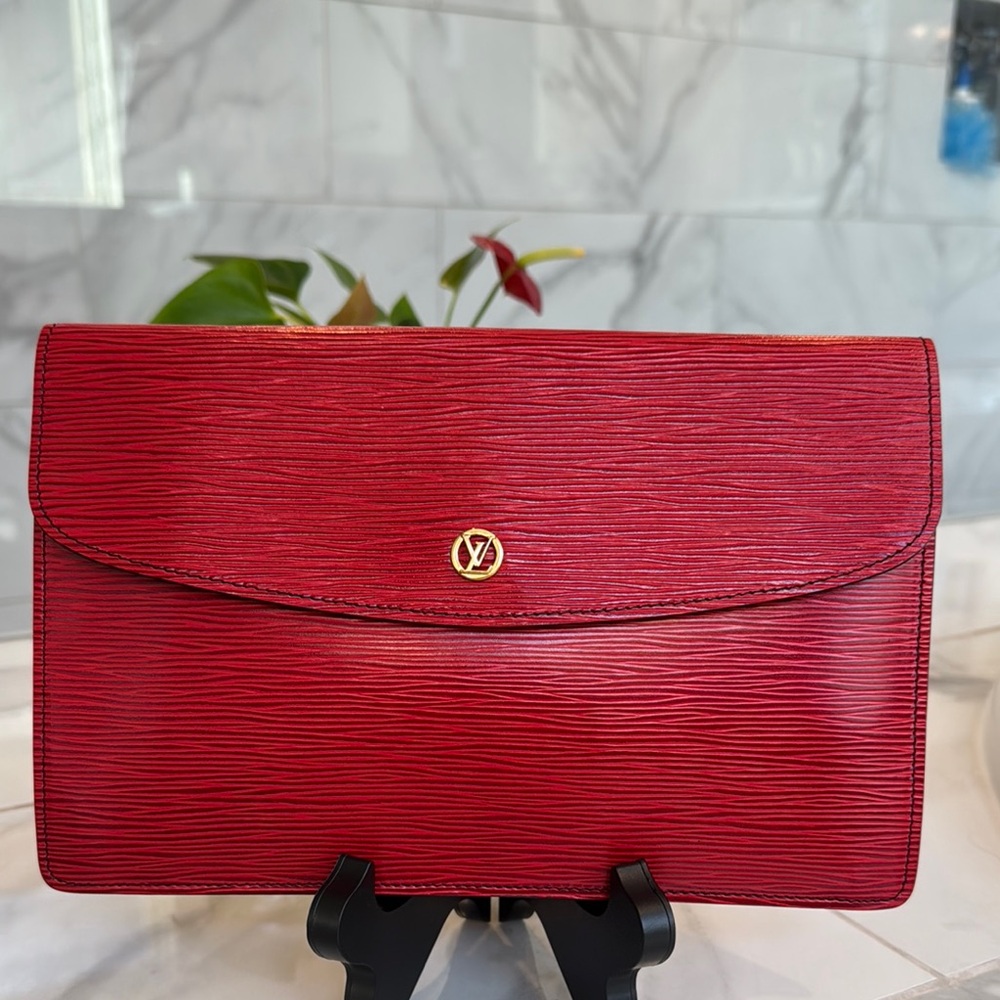 Louis Vuitton Elegant Red Textured Clutch with Gold Accent